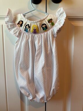 Hand-Smocked White Baby One-Piece with Pastel Dot and Character Embroidery